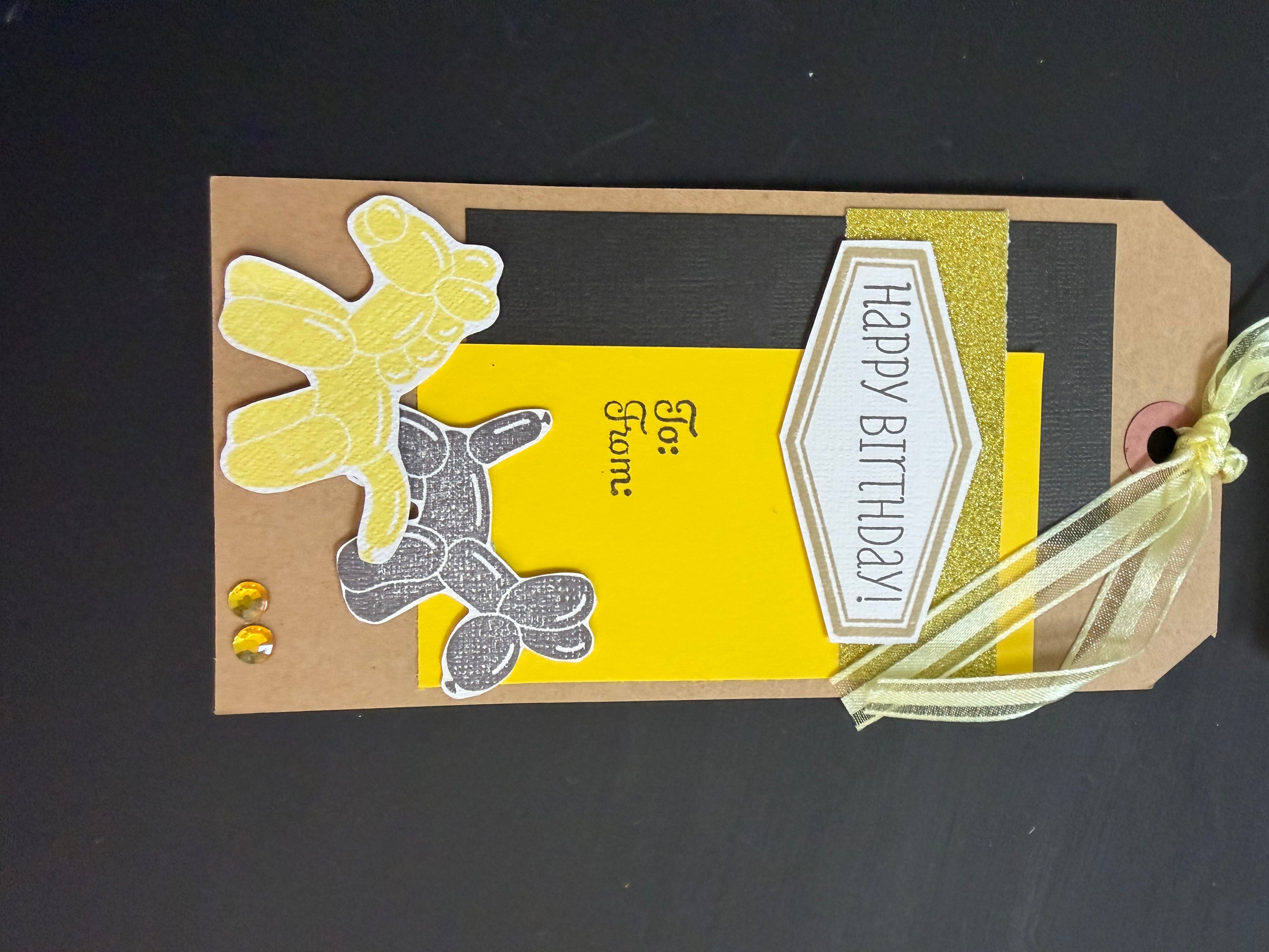 Yellow balloon animal birthday tag